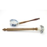 Kitchenalia : Two Continental cooking utensils with ceramic ends and turned wooden handles, the