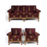 A Victorian three piece suite comprising a settee and two armchairs, having burgundy and gold