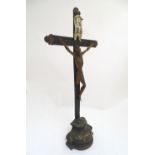 A large 19thC polychrome crucifix with an I. N. R. I. flag and a carved wooden Corpus Christi,