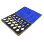 12 assorted silver souvenir teaspoons with enamel direction to handles depicting town coat of arms