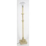 A carved and painted wooded standard lamp with reeded column on a squared base. Approx 60" high
