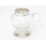 A glass jug / noggin with silver mount hallmarked Birmingham 1907 maker Jones & Crompton 2 3/4" high