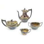 A 4 piece silver plate teaset comprising cream jug, sugar, teapot and hot water pot. The tallest