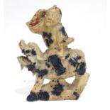 A Chinese soapstone model of a figure riding a Qilin style creature. Approx. 5 1/2" high Please Note