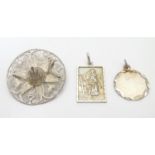 Two silver pendants comprising a St Christopher of rectangular form stamped Sterling Silver, JAM,