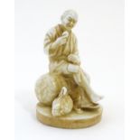 An Oriental figure modelled as a seated man holding an egg with a chicken by his feet. Impressed