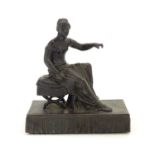 A 19thC bronze figure of a woman seated on an x-frame stool mounted on a fringed rectangular base.