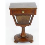 A William IV walnut work box / sewing table with a single short drawer and basket above a turned