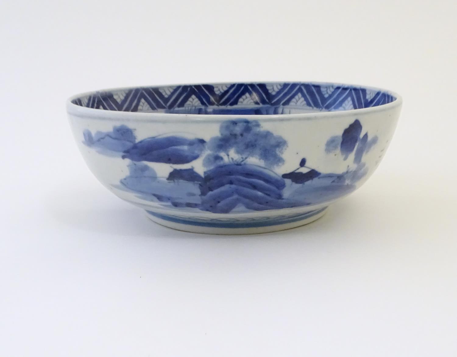 A Chinese blue and white bowl with hand painted decoration depicting an Oriental landscape with - Image 6 of 10