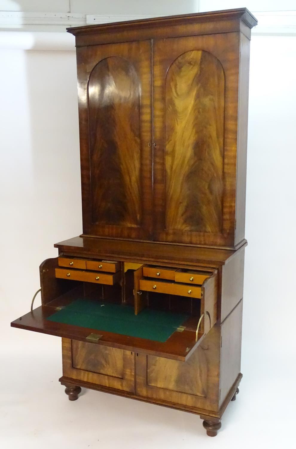 A mid 19thC mahogany secretaire bookcase, having a moulded cornice above two flame mahogany panelled - Bild 8 aus 8