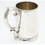 A mid 19thC silver plated 1 pint tankard by Harrison of Sheffield. 5 1/2" high Please Note - we do