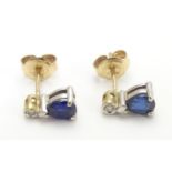 9ct earrings set with topaz and diamonds 3/8" long Please Note - we do not make reference to the