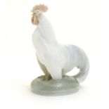 A Royal Copenhagen porcelain model of standing Cockerel. Marked under. Approx. 4 1/4" high Please