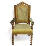 A mid / late 19thC oak armchair with a pointed pierced cresting rail, moulded frame and raised on