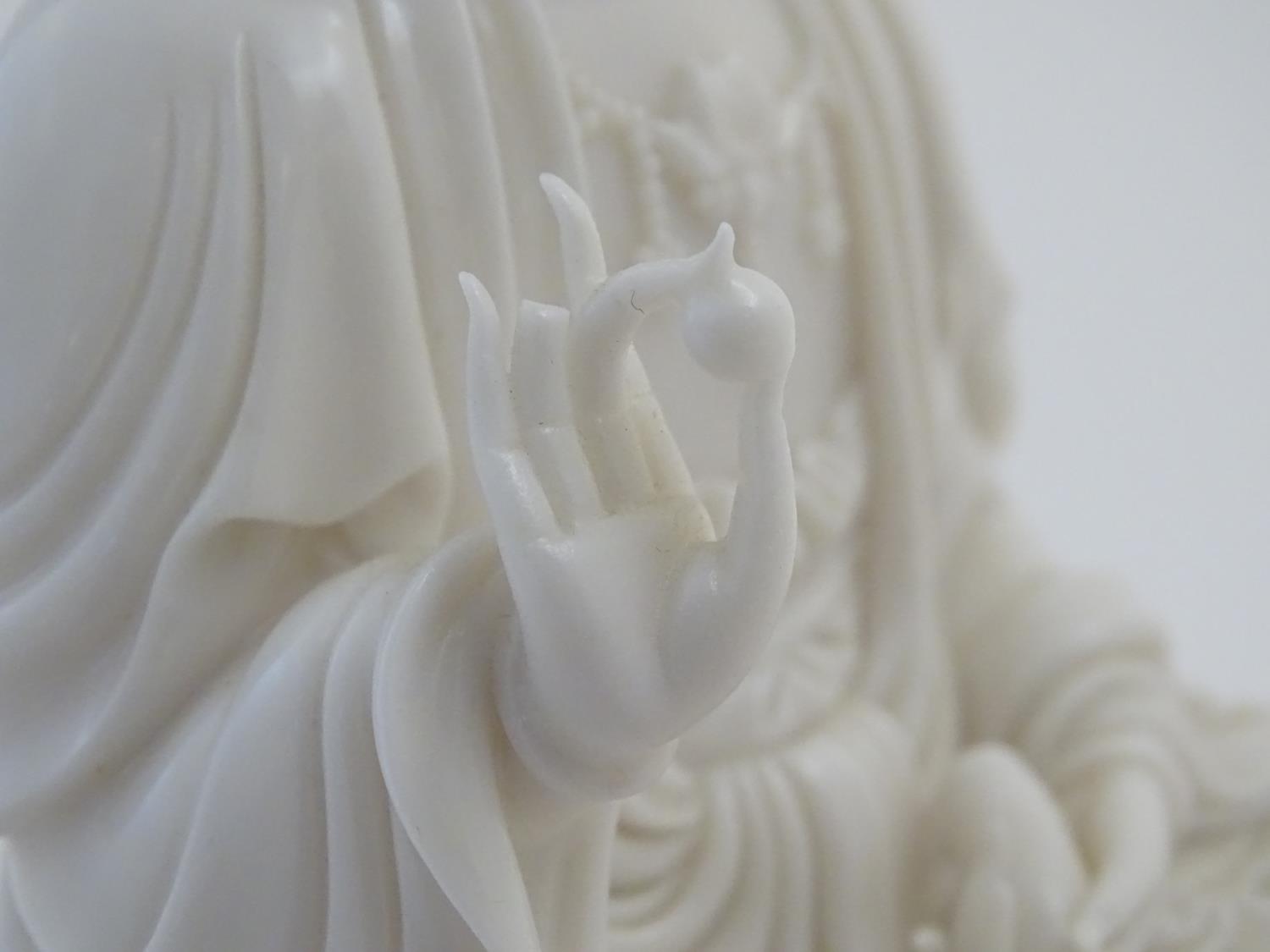 A Chinese blanc de chine figure depicting Guanyin seated on a lotus flower base. Approx. 7 1/2" high - Image 7 of 16