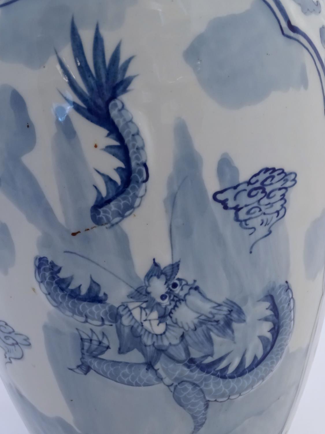 A large Chinese blue and white vase decorated with flowers, foliage and a stylised phoenix and - Image 7 of 10