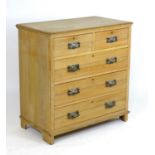 A late 19thC pine chest of drawers with a rectangular top above two short over three long