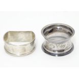 Two silver napkin rings, one D-shaped with engine-turned decoration, hallmarked Birmingham 1965