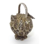 A white metal pendant / model formed as a filigree jar / vessel. Approx 1 /2" long Please Note -