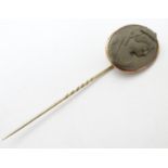 A Victorian yellow metal stick pin set with larva cameo to top, 3 1/2" long Please Note - we do