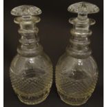 A pair of three ring cut glass decanter with hobnail banding. Approx 11 1/4" high Please Note - we
