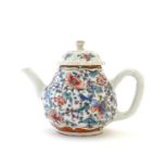 A Chinese teapot with scrolling floral and foliate detail. Approx. 4 1/2" high Please Note - we do