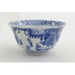 A Chinese blue and white footed bowl with a flared rim, decorated with a scene depicting the