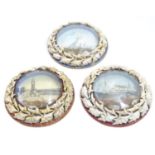 Three 20thC souvenir dioramas with shell art borders and printed coastal scenes, one depicting the