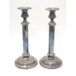 A pair of silver plate candlesticks Approx. 12" high Please Note - we do not make reference to the