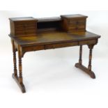 A late 19thC Aesthetic movement desk by Gillows of Lancaster with two banks of drawers flanking a