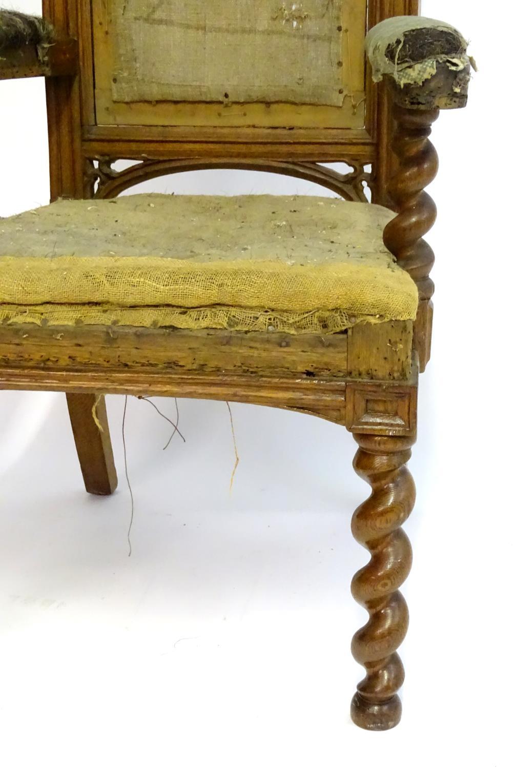 A mid / late 19thC oak armchair with a pointed pierced cresting rail, moulded frame and raised on - Bild 4 aus 6