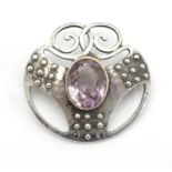 Murrle Bennett & Co. : An Arts & Crafts .950 silver brooch with hammered decoration and set with