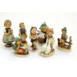 A collection of seven vintage Hummel figurines, comprising #47 Goose Girl, #58/0 Playmates, #63