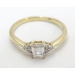 A 9ct gold ring set with cubic zirconia. Ring size approx M Please Note - we do not make reference