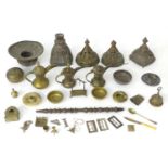 An assortment of Eastern metalware, including teapots, dishes, pendant lamp shades, various shisha