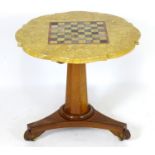 A Victorian marble top table with a shaped top and games board to centre, the bottom having a