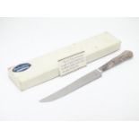 A silver handled cake knife hallmarked Sheffield 1975. Harrison Brothers 10" long Please Note - we