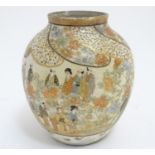 A Japanese Satsuma vase with hand painted decoration depicting figures, geisha girls etc. in a