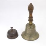 Two late 19th / early 20thC bells comprising a counter / desk bell and a brass hand bell with a