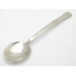 An Art Deco silver jam / preserve spoon. Hallmarked Chester 1947 maker JH. 5 1/4" long. The spoon to