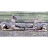 Garden & Architectural, Salvage: a pair of stone garden ornaments formed as couchant hounds / dogs