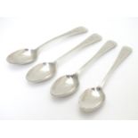 A set of 4 Victorian silver Old English pattern teaspoons with bright cut engraved decoration .