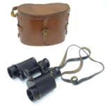 A cased pair of binoculars / Field Glasses by A. Kershaw & Sons, Leeds, stamped 1941,