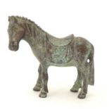 An Oriental bronze model of standing horse with saddle. Approx. 4" high Please Note - we do not make