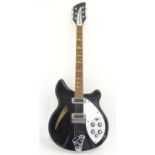 Musical Instrument: a Rickenbacker model 360 hollowbody electric guitar, in 'Jetglow' black