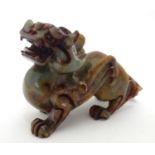 A Chinese carved soapstone model of a stylised foo dog. Approx. 4 1/4" high Please Note - we do