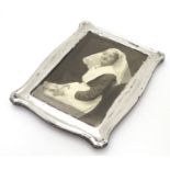 A photograph frame with silver surround. Hallmarked Birmingham 1912 maker Jones & Crompton. 7"