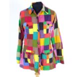 A vintage multi coloured patchwork blouse/shirt with patch pockets and belt loop. Bust size 32"