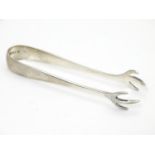 Silver sugar tongs with bird?s claw formed grips. Hallmarked Birmingham 1938 maker Barker Bros