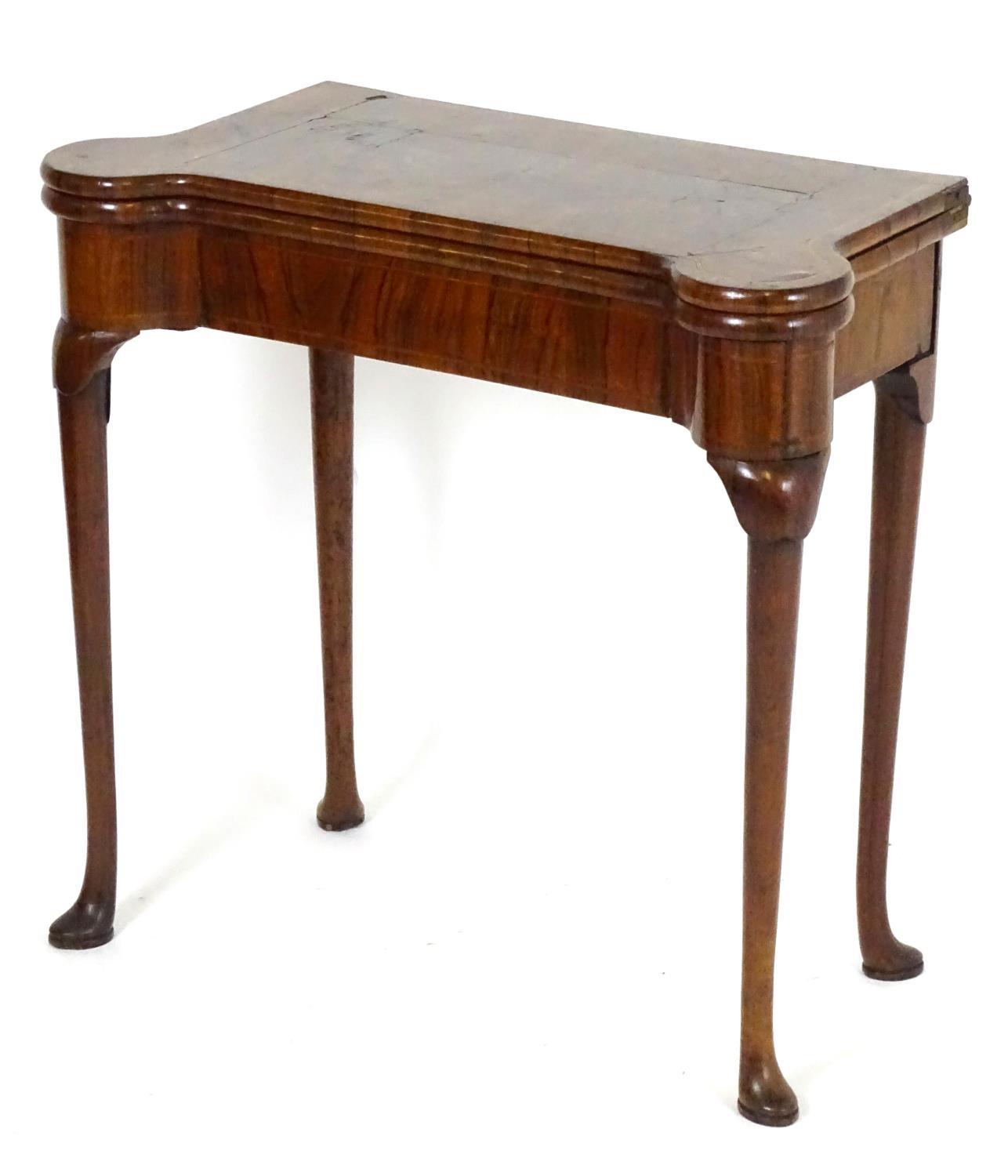 A George I walnut card table with castellated corners, opening to show a baize playing surface and - Bild 6 aus 10